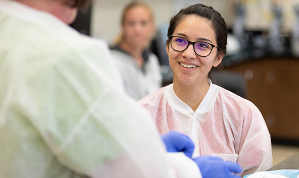  Medical Assisting student studying in a lab classroom 